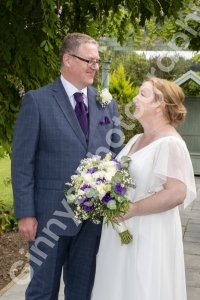 Bride and groom lovingly looking at each other
