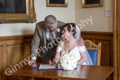 bride and groom signing the register at cleethorpes registry office