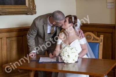 Bride and groom kissing after signing the register at cleethorpes registery office