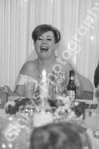 black and white image of the bride laughing